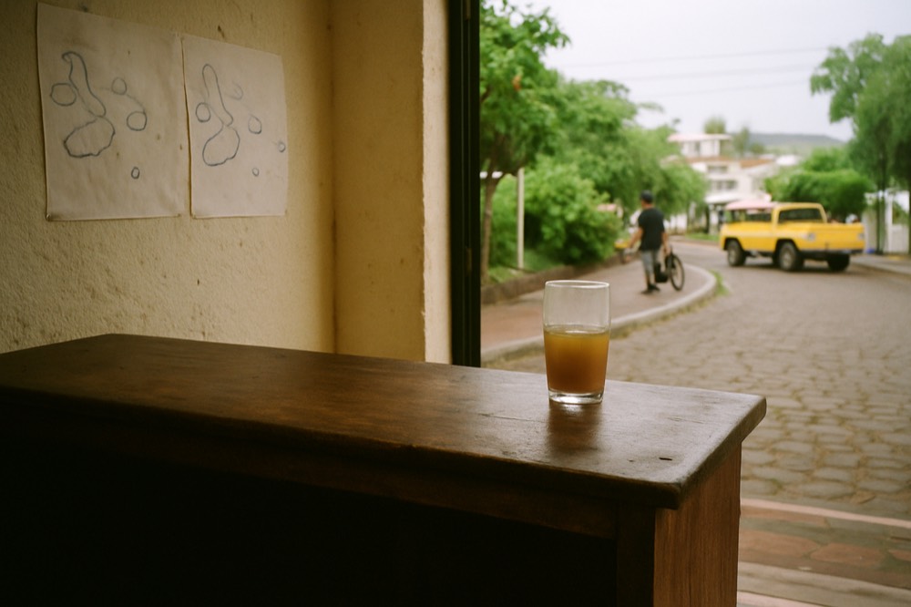 A wooden reception desk in a Puerto Ayora tour office with maps of the islands on the wall